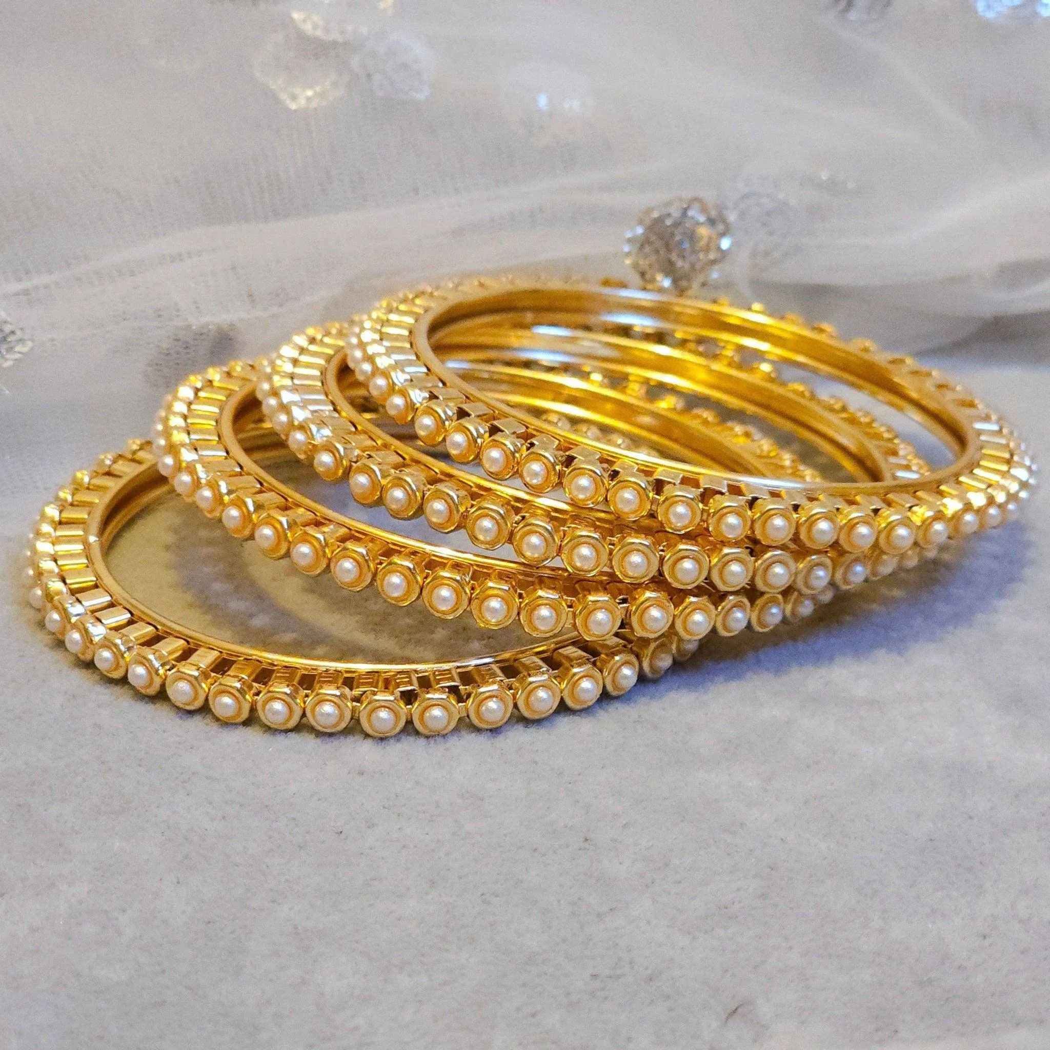 Set of 4 Elegant Pearl Bangles for a Touch of Class  Perfect for Any Occasion